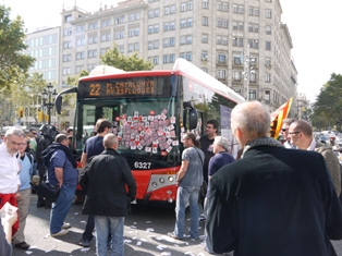 Strikers stop a scab bus with stickers in a general strike in Spain